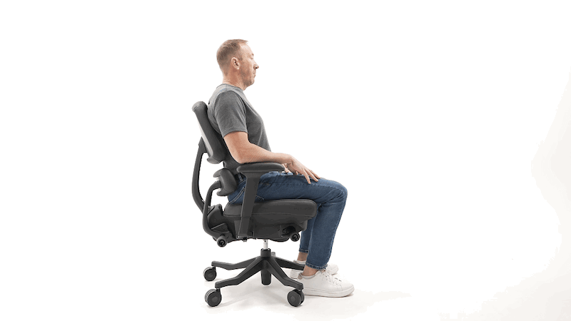 Man reclines in the Anthros chair.