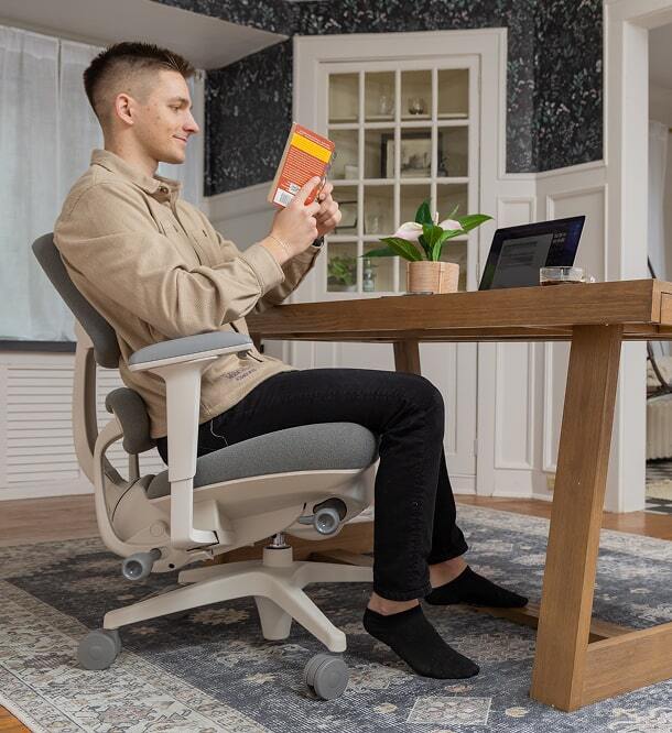 Man in the Anthros chair with light spring, easily reclining.